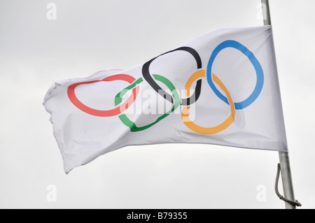 The Olympic flag takes its place beside the Union Jack in front of the Tower Bridge outside London City Hall. Stock Photo