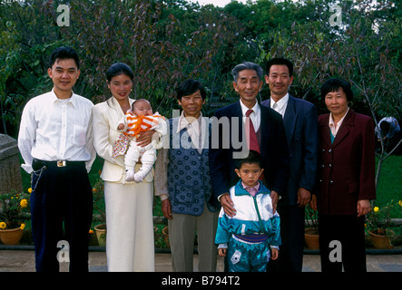 Chinese family, mother, father, children, extended family, 3, three, generations, eye contact, front view, portrait, family portrait, Kunming, China Stock Photo