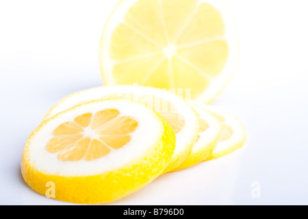 Sliced lemon on white plate Stock Photo