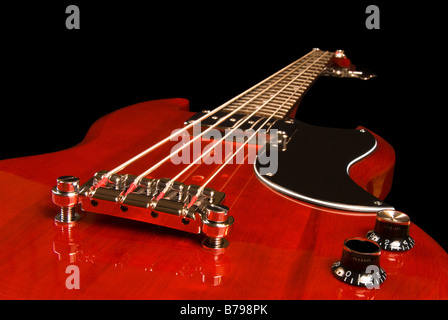 A low angle view of a beautiful wooden electric guitar isolated on black Stock Photo