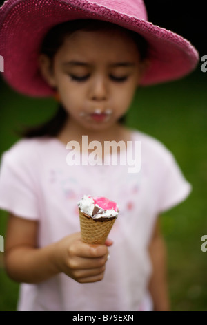 Five year old girl eating ice cream Stock Photo