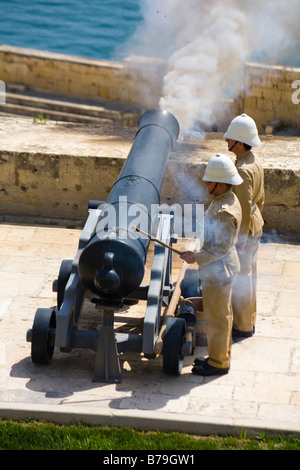 Firing of the noon day gun, at the Saluting Battery, Upper Barracca Gardens, Valletta, Malta Stock Photo