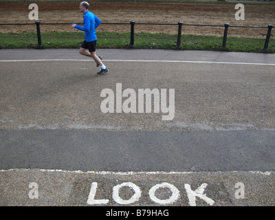 Man jogging in Hyde Park Stock Photo