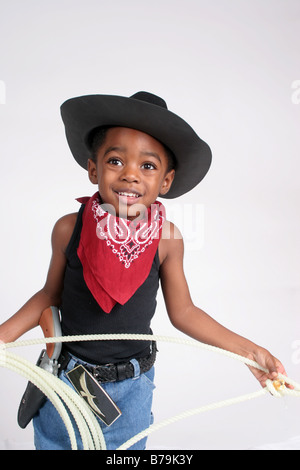 African American boy  in  cowboy outfit, with bandanna and rope Stock Photo