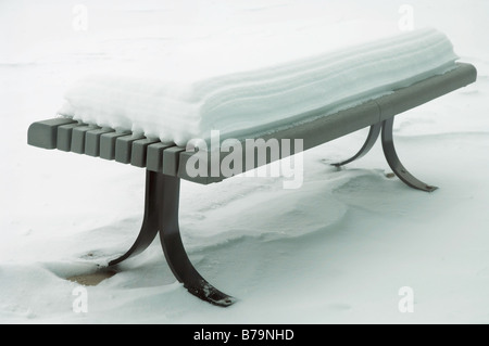 Yellow tennis ball on bench by tennis court Stock Photo