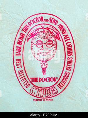 Printed ephemera / Citrus fruit wrapper from Cyprus - The Doctor illustration on tissue paper. Stock Photo