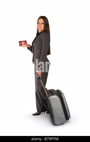 Attractive young woman standing with luggage and passport on white background Stock Photo