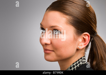 Attractive young woman looking off into distance Stock Photo