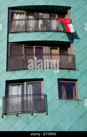 Palestine flag hanging out of an apartment in support of the anti Israel war against Gaza rally, in Albert Square, Manchester Stock Photo