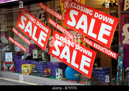 Closing down sale signs in shop window Bristol England 2009 Stock Photo