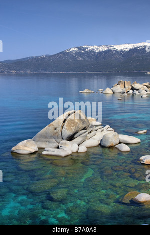 HDR tonemapped Whale rock and snowy mountains on the east shore of Lake Tahoe in the spring Stock Photo