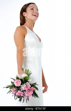 Portrait Of Bride Holding Bouquet Of Flowers Stock Photo