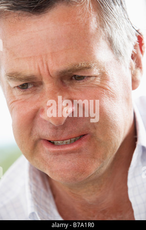 Middle Aged Man Frowning