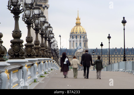 Paris - Alexandre III bridge and Invalid church and family Stock Photo