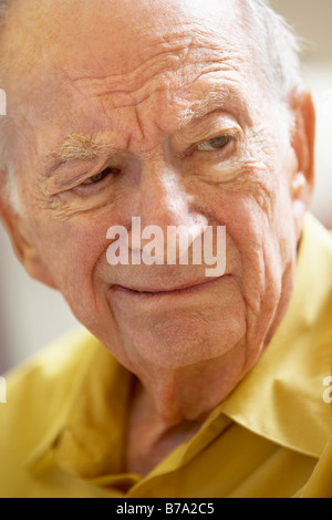 Portrait Of Senior Man Frowning Stock Photo