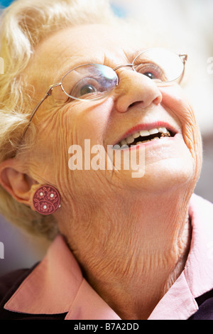 Portrait Of Senior Woman Smiling Happily Stock Photo