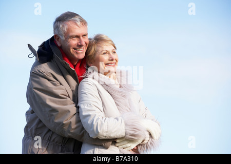 Senior Couple Embracing In Park Stock Photo