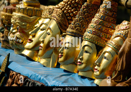 Souvenirs, row of gold painted masks carved out of wood, Indein, Inle Lake, Shan State, Burma, Myanmar, Southeast Asia Stock Photo