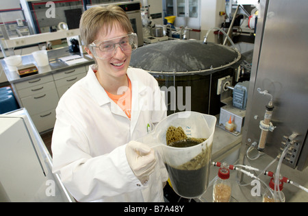 Biotechnologist working in the technical laboratory on a batch fermenter for a biogas plant of the Schmack Biogas AG in Schwand Stock Photo