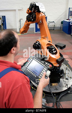 Employee testing the machines at the Robot production in the KUKA Roboter GmbH, responsible for the robotics department of the  Stock Photo