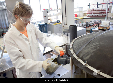 Biotechnologist working in the technical laboratory on a batch fermenter for a biogas plant of the Schmack Biogas AG in Schwand Stock Photo