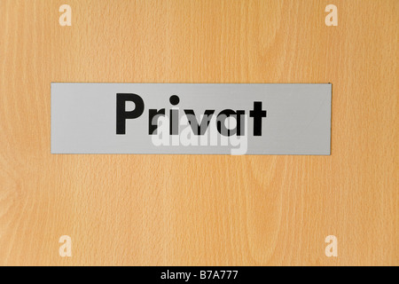 Sign on a door reading Privat, Private, symbol for privacy Stock Photo
