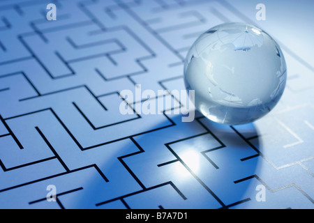 Crystal globe on maze Stock Photo