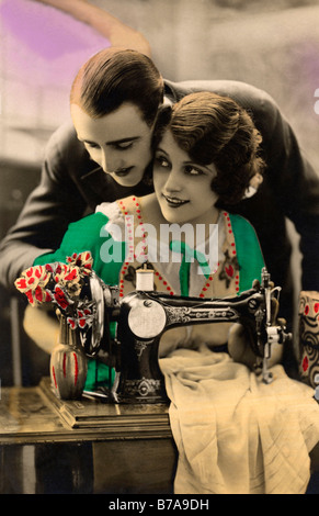 Historic photo, couple with sewing machine, ca. 1920 Stock Photo