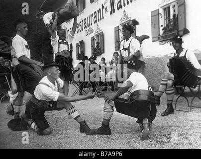 Historic photo, Bavarians doing 'Fingerhakeln', Bavaria, Germany, ca. 1930 Stock Photo