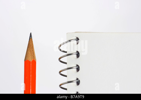 Spiral notebook and pencil, detail Stock Photo