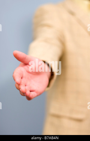 A businessmans outstretched hand Stock Photo