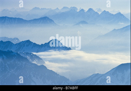 View of mountain silhouettes seen from the Zugspitze mountain, Bavaria, Germany, Europe Stock Photo