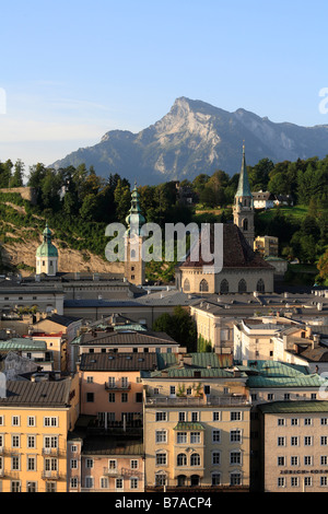 View from Kapuzinerberg Hill over historic district of Salzburg with Church St. Peter and Franciscan church, Untersberg mountai Stock Photo