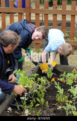 Children visit a local allotment project to learn about gardening and the environment Stock Photo