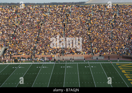 Fans pack the University of Michigan football stadium for a college football game. Stock Photo