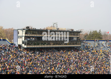 Fans pack the University of Michigan football stadium for a college football game. Stock Photo