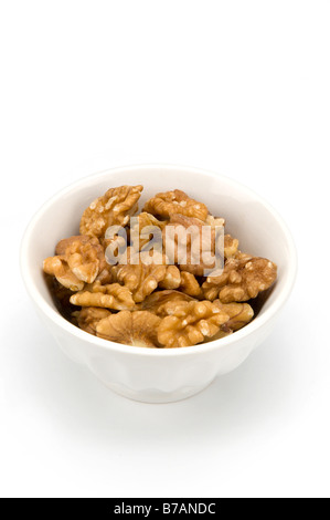 Walnuts in white bowl Stock Photo