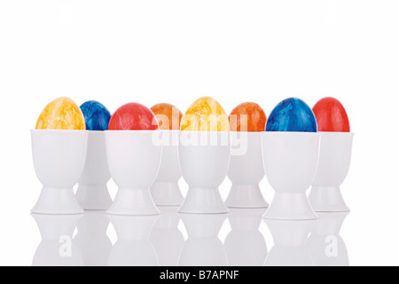 Colourful easter eggs in eggcups Stock Photo