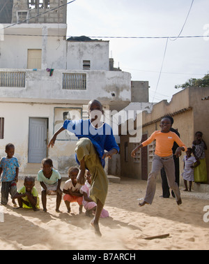 Children jump, laugh, smile, and play in the fishing village of Yoff, 30 minutes from Senegal's capital city of Dakar. Stock Photo