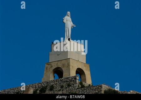 Statue of Jesus Christ at the end of The Jairan Wall Of La Conjunto Monumental De La Alcazaba Almeria Spain Spanish Statues Stock Photo