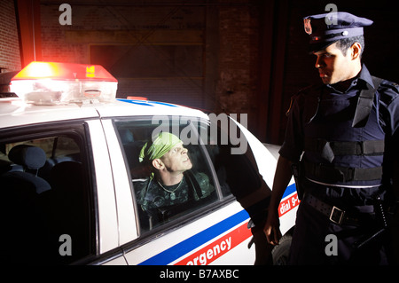 Police Officer Arresting Suspect Stock Photo