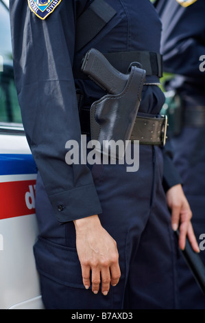 Close-up of Police Officer's Gun Stock Photo