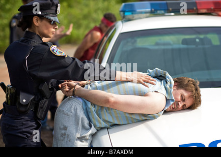 Police Officers Arresting Suspects Stock Photo