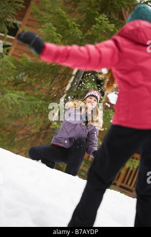 Women Throwing Snowballs, Government Camp, Oregon, USA Stock Photo