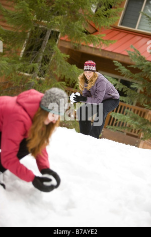 Women Throwing Snowballs, Government Camp, Oregon, USA Stock Photo