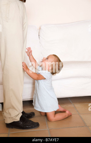 Little Boy Reaching For Father Stock Photo