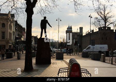 Cardiff Castle in the background, with statue of Aneurin Bevan in the foreground, Cardiff, South Wales, U.K. Stock Photo