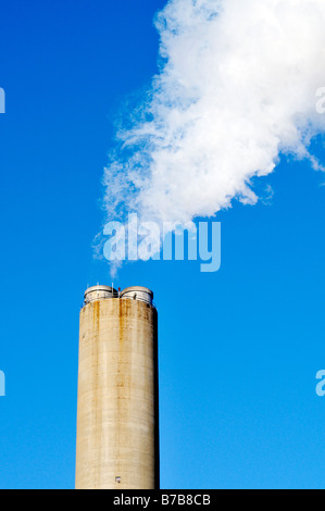 Exhaust from smokestack at power plant Stock Photo