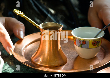 Woman Enjoying Bosnian (Turkish) Coffee in Sarajevo Bosnia Stock Photo