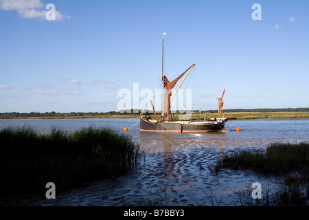 A Victorian spritsail barge lies at anchor on the River Alde near Aldeburgh Suffolk Stock Photo